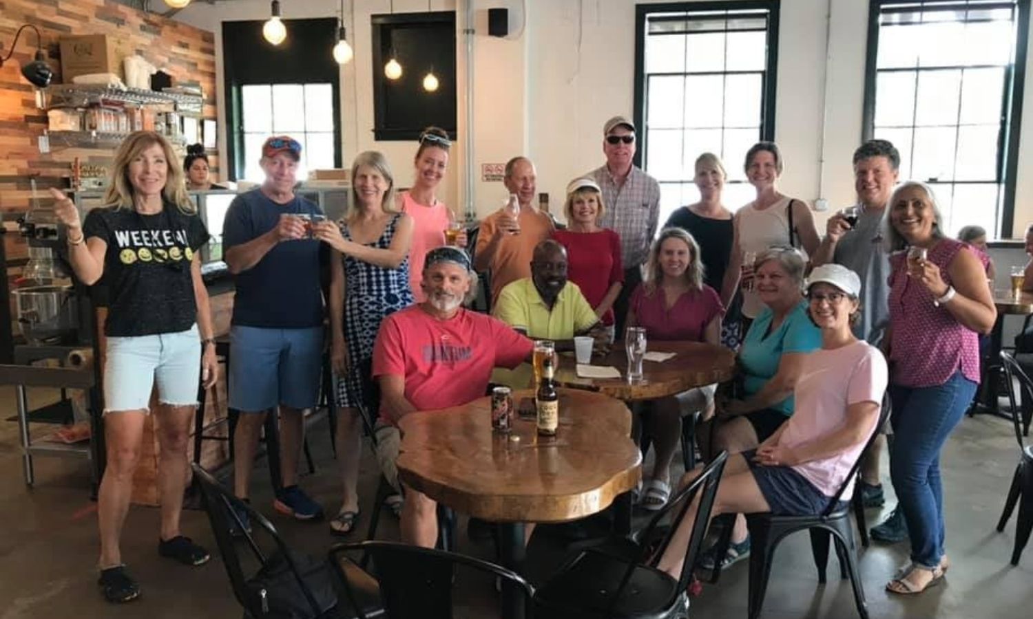 Group at a social happy hour drinking wine.